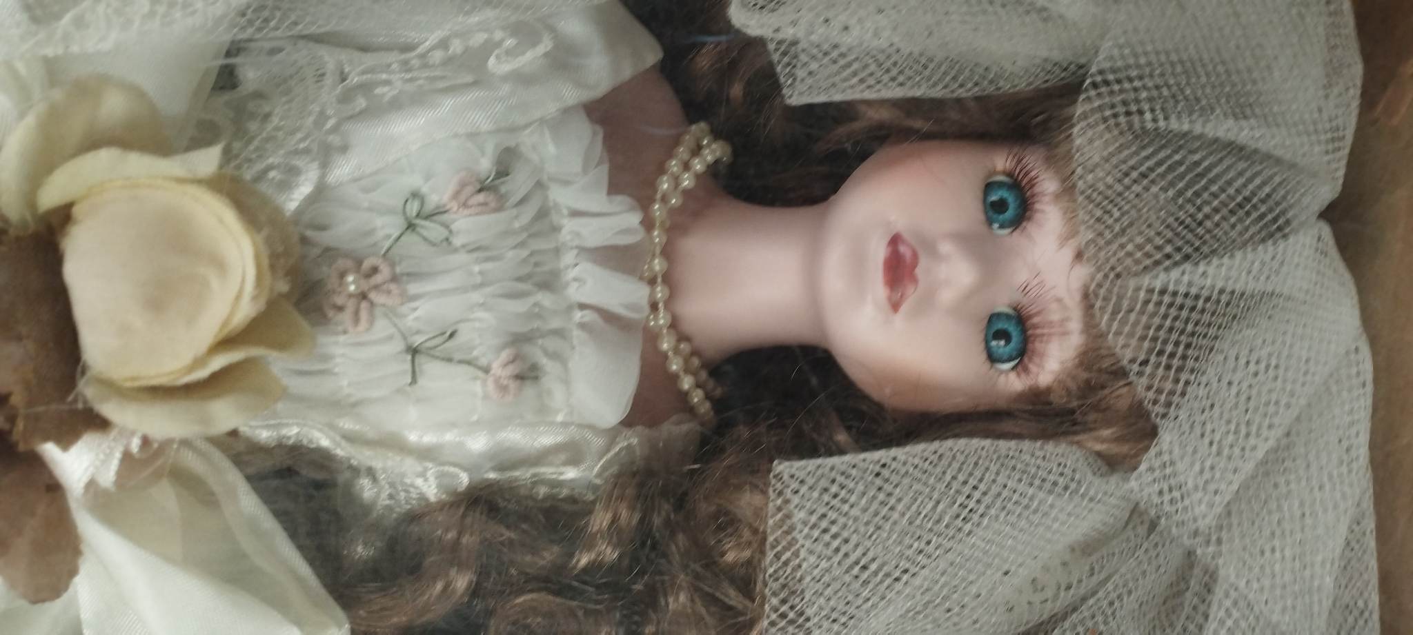 PORCELAIN DOLL ON A ROCKING CHAIR PORCELAIN DOLL ON A ROCKING CHAIR